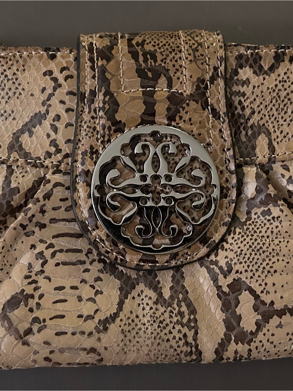 Taupe Snake-Print Clutch Wristlet with Decorative Silver Medallion